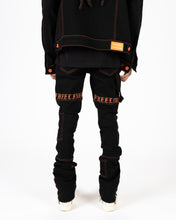 Load image into Gallery viewer, PHEELINGS DEFYING ODDS FLARE STACK DENIM (JET BLACK/ORANGE)